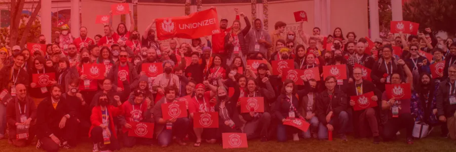 A photo of CWA members rallying with CODE-CWA signs and a big "Unionize" banner.